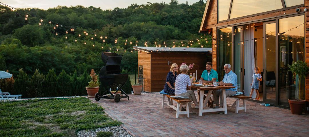 Family Dinner Around Dining Table Garden