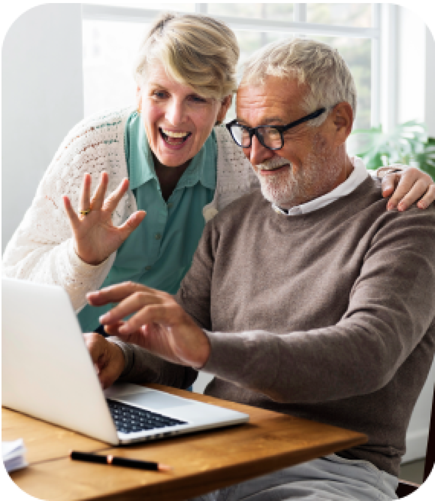 Couple Waives at Laptop